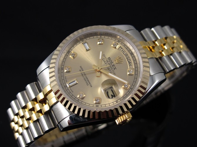 rolex oyster perpetual day date silver and gold